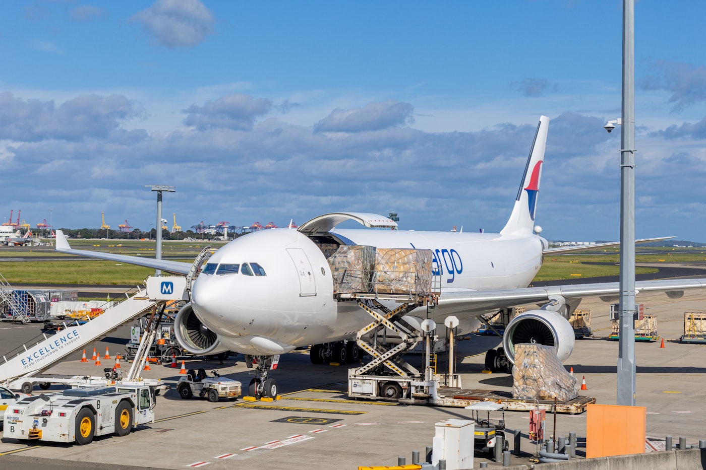 Cargo aircraft being loaded at an airport